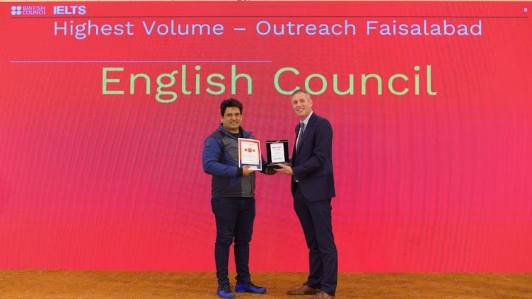 Best IELTS Institute in Faisalabad - English Council director receiving an award from the British Council
